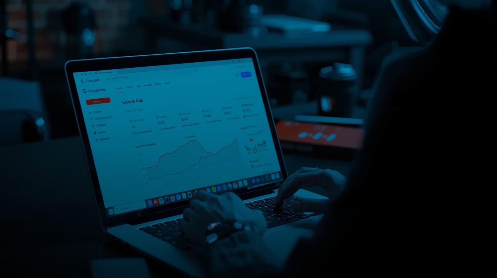 Digital marketer adjusting Google Ads campaign settings on a laptop